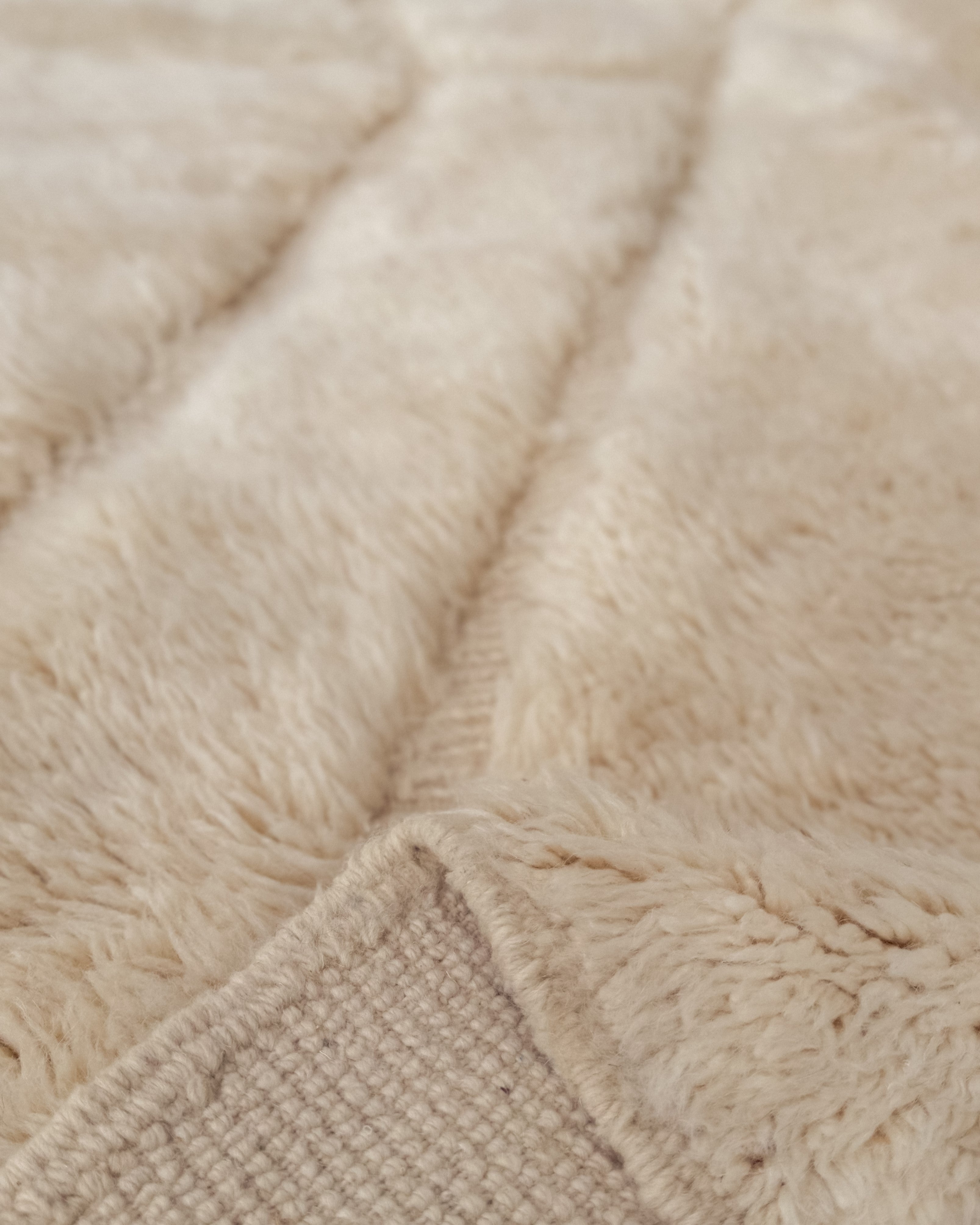 Close-up detail of Beni Mrirt Moroccan wool rug No. 3, showing handwoven texture and natural wool fibers