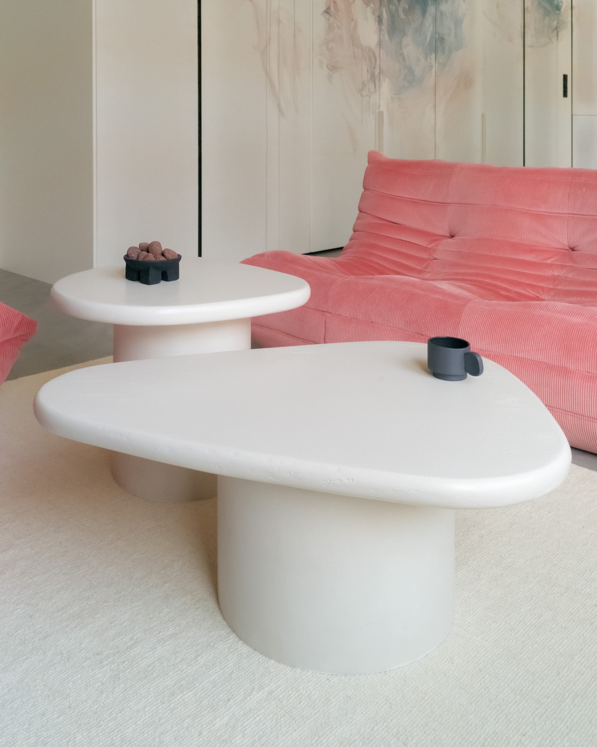 Detail view of Kanso organic coffee table set in seamless microcement finish