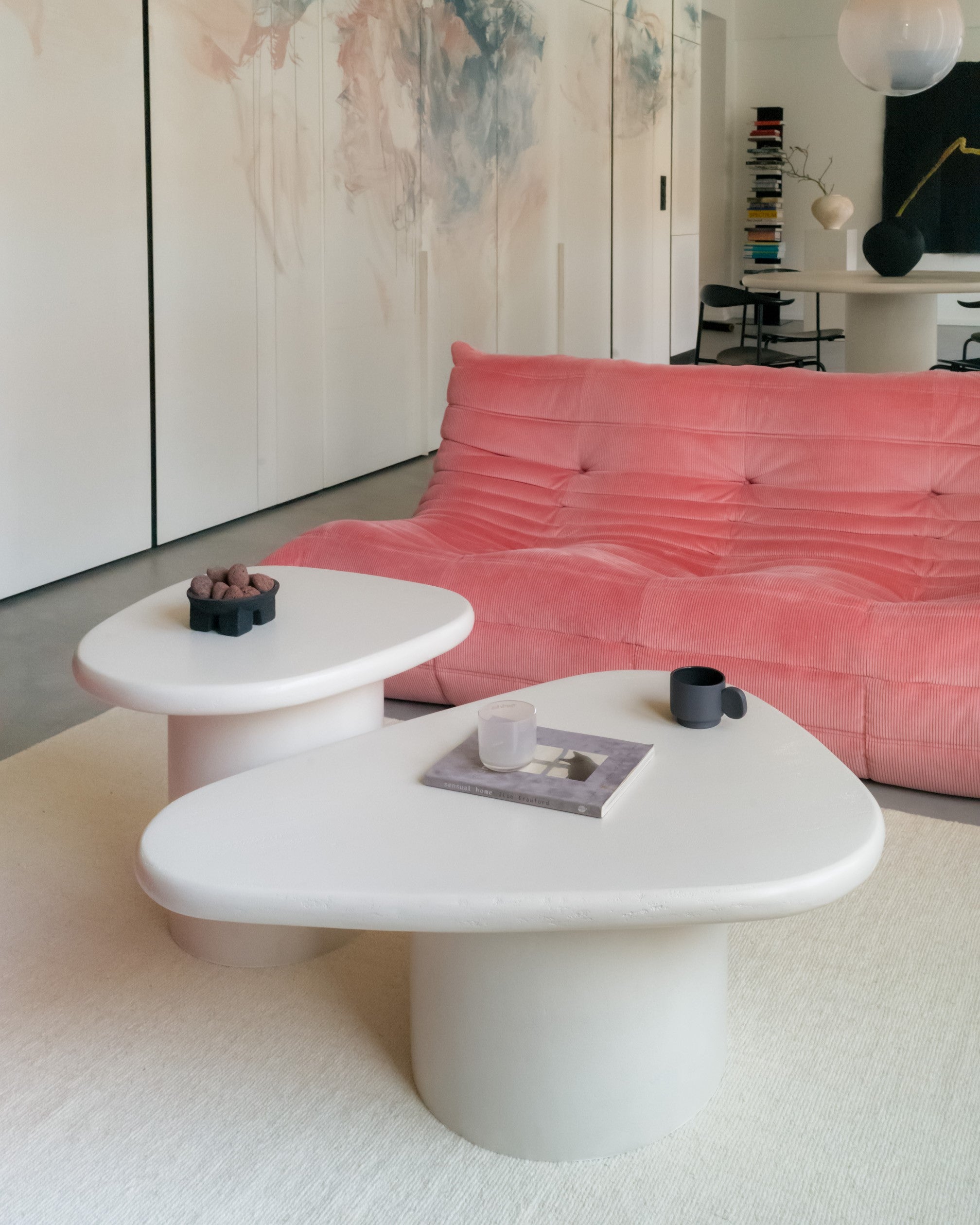Kanso organic microcement coffee table set styled in living room with pink sofa