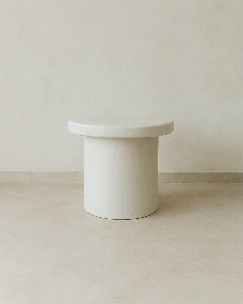 Front view of Kanso round microcement side table with monolithic form