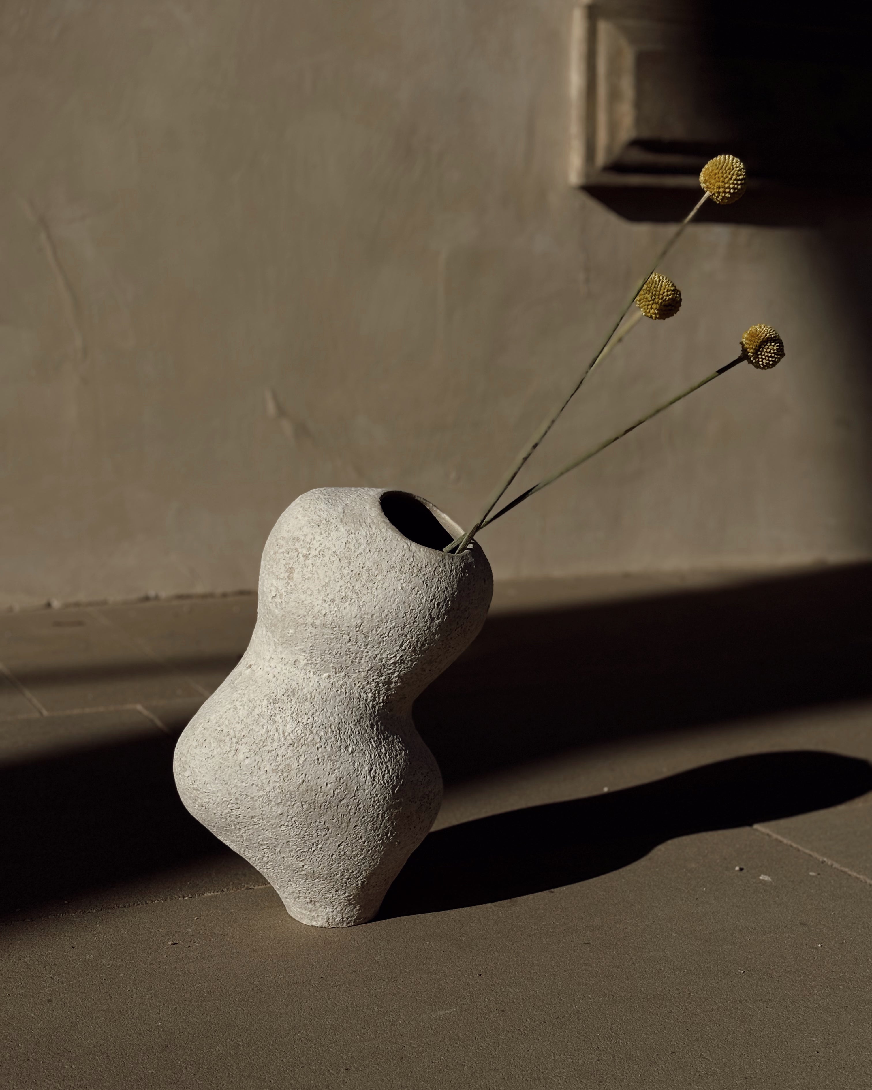 Li Ceramics grey ceramic vase with sculptural organic shape on dark background