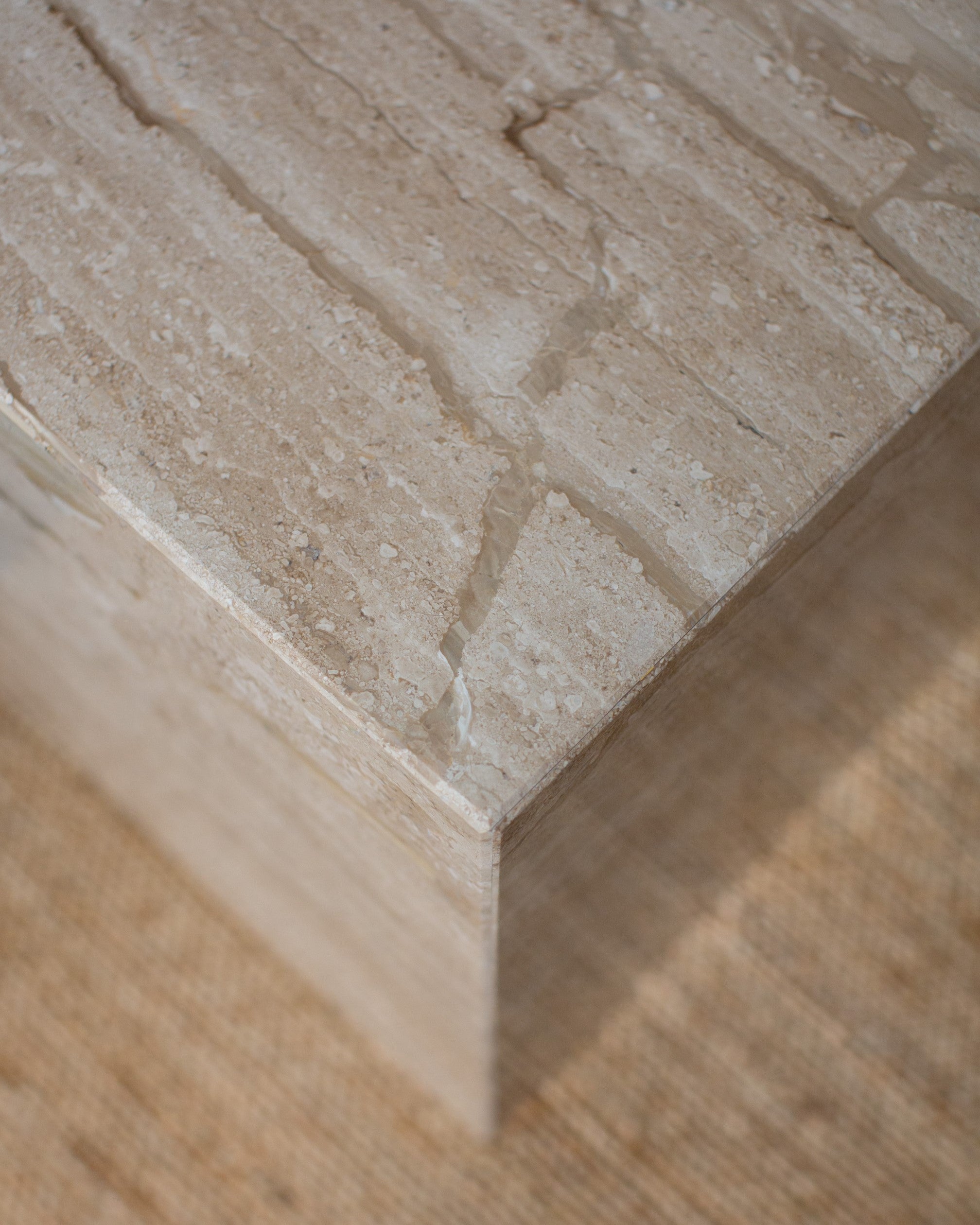 Close-up of Mitsu marble side table, polished Diano Reale stone texture