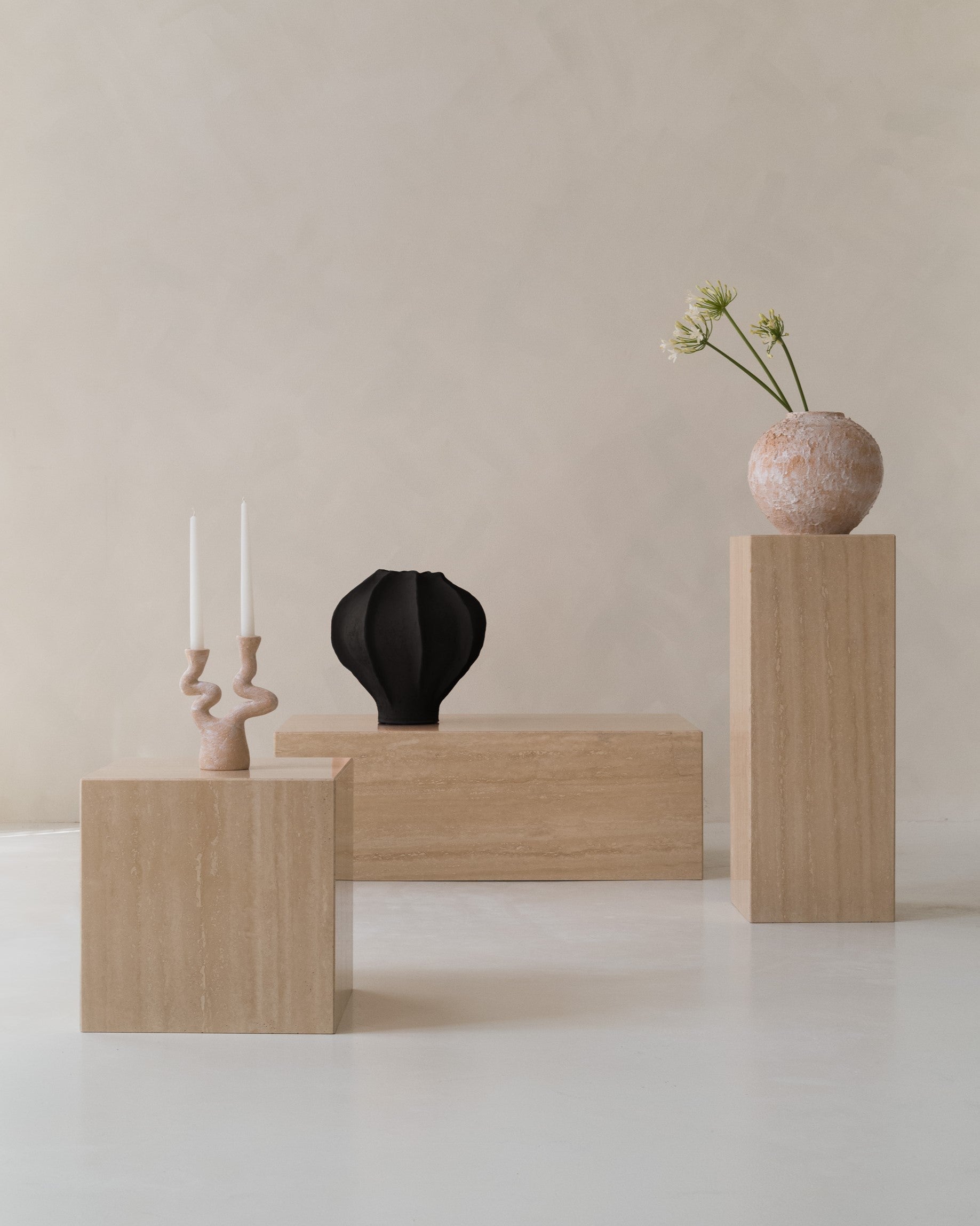 Travertine side tables with minimalist design, natural stone texture and decor