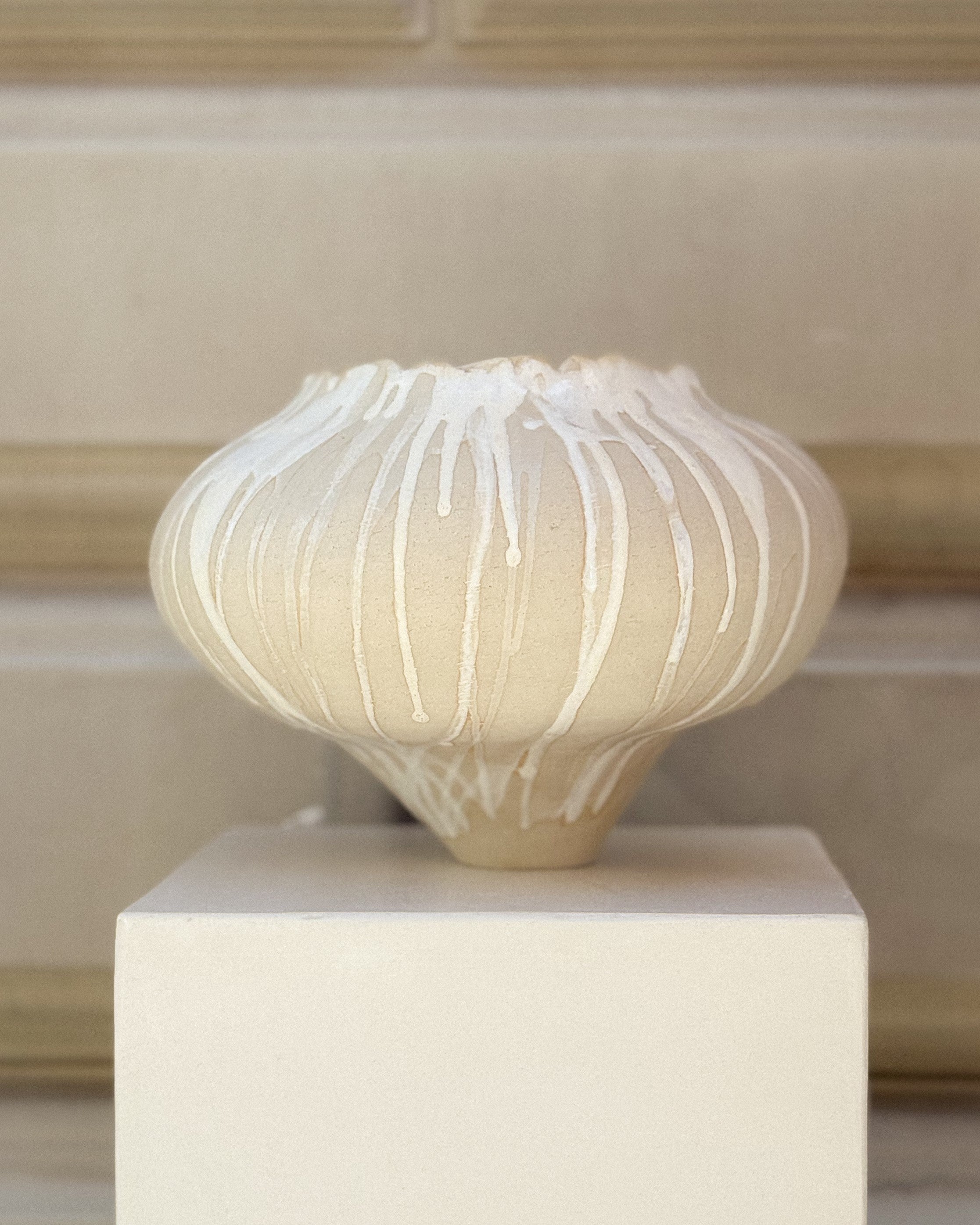 Handmade ceramic vase Muoi Atelier x Syneste, front view with white flowing glaze.