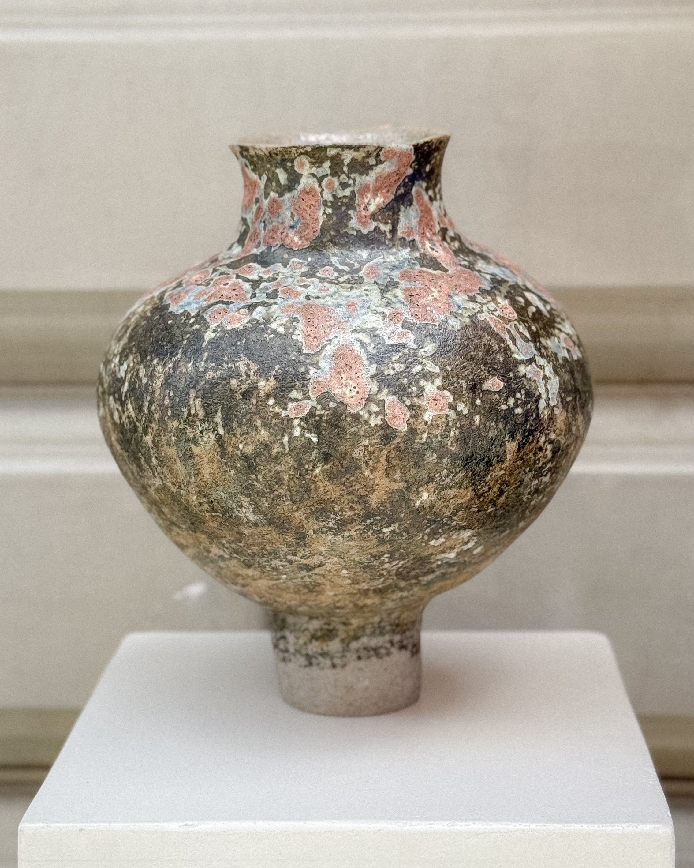 Handcrafted ceramic vase by Lucia Okániková for Syneste, featuring an organic glaze and sculptural silhouette.