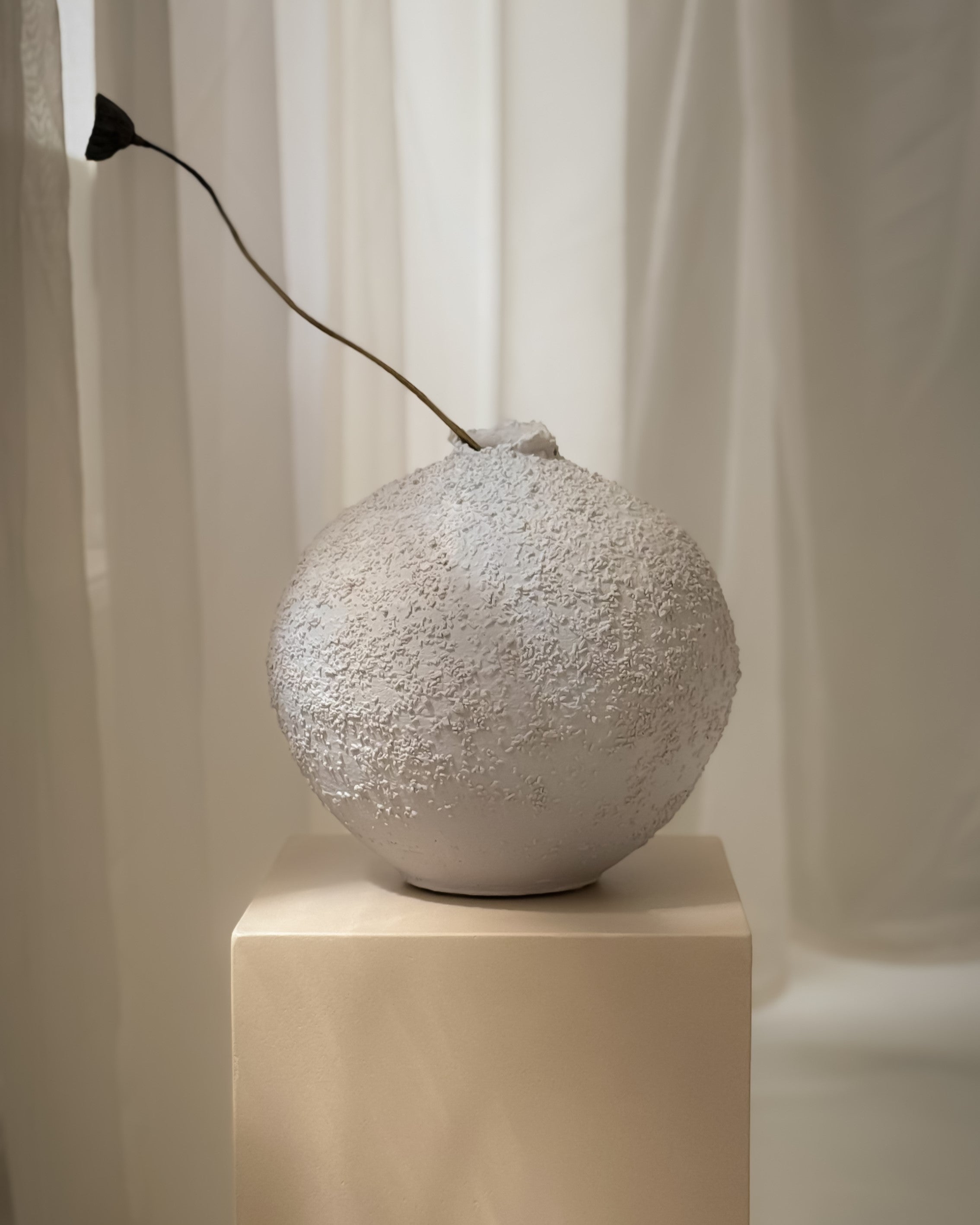 Sabi Vase no. 2, handmade white ceramic vase styled with a single dried branch