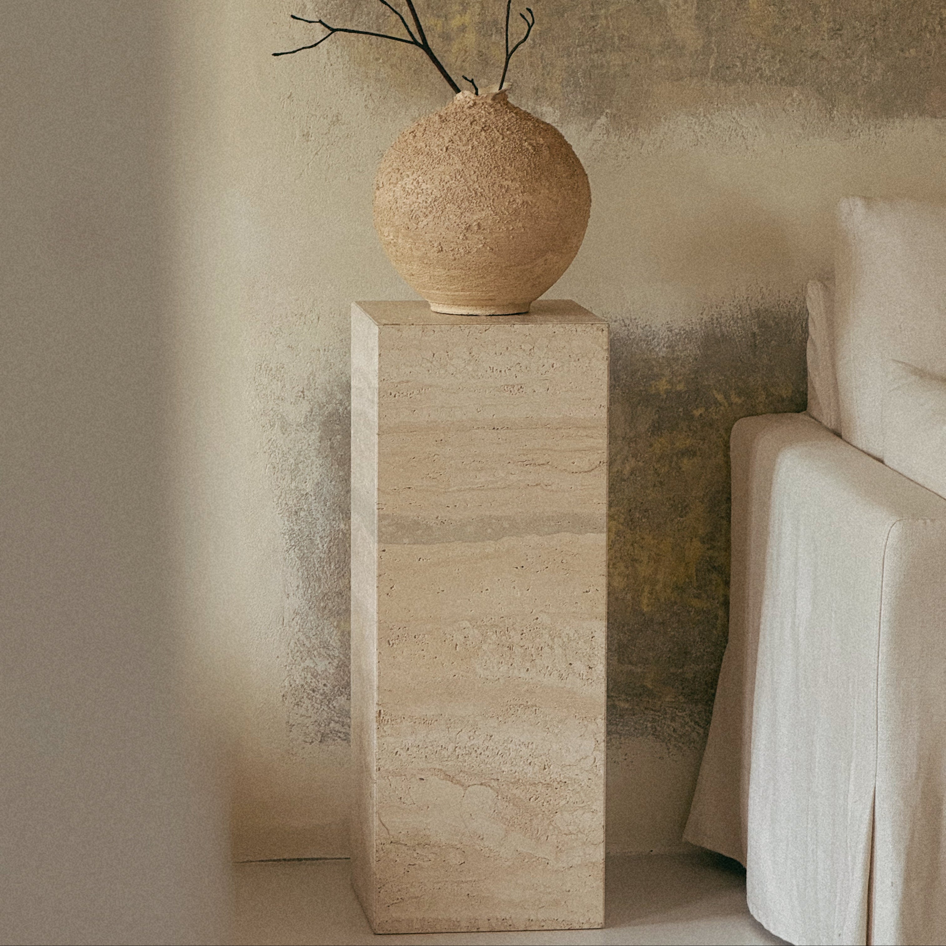 Mitsu stone collection – natural stone tables combining timeless design with the raw beauty of marble and travertine.