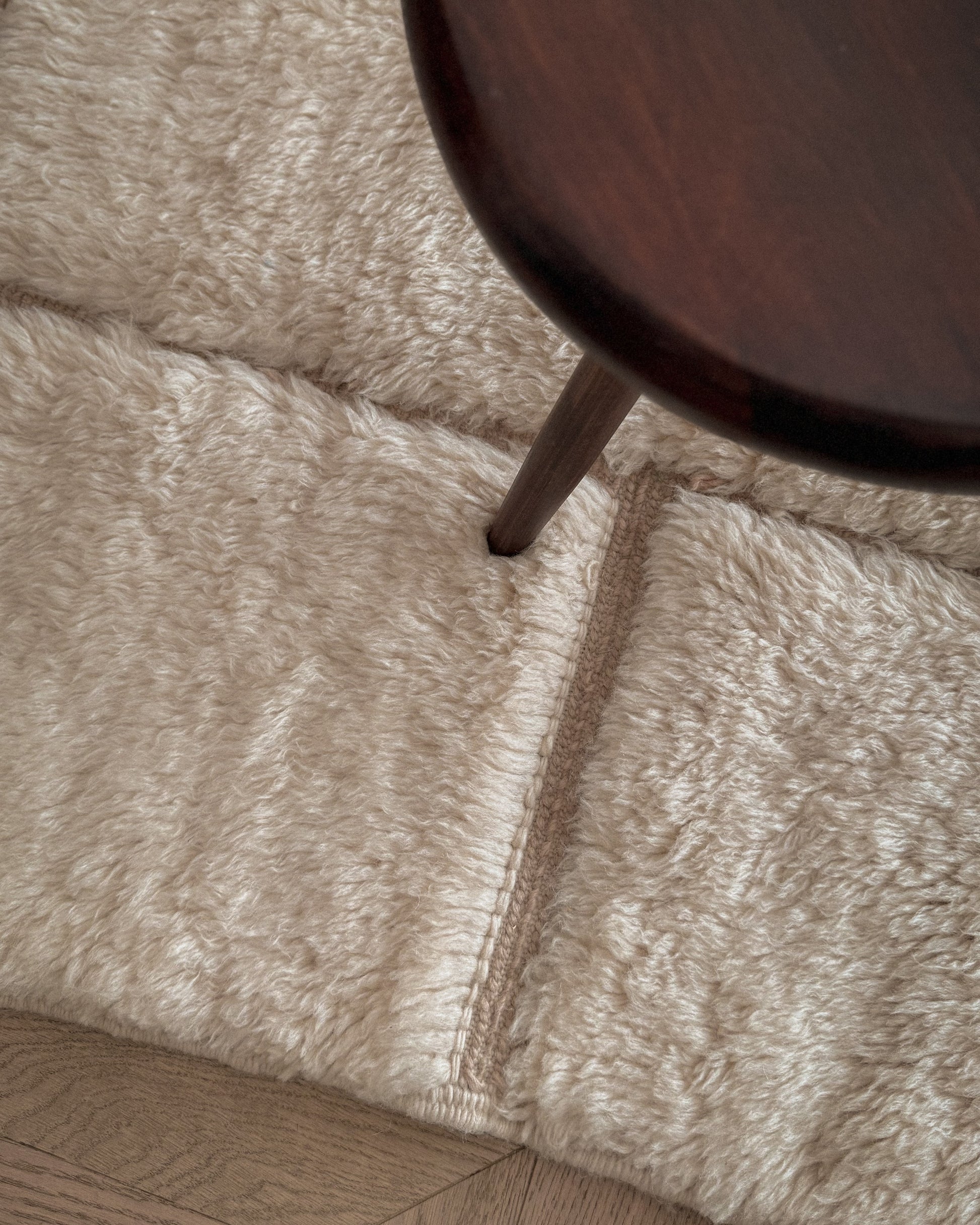 Moroccan Beni Mrirt wool rug No. 4 in modern living room setting with chair