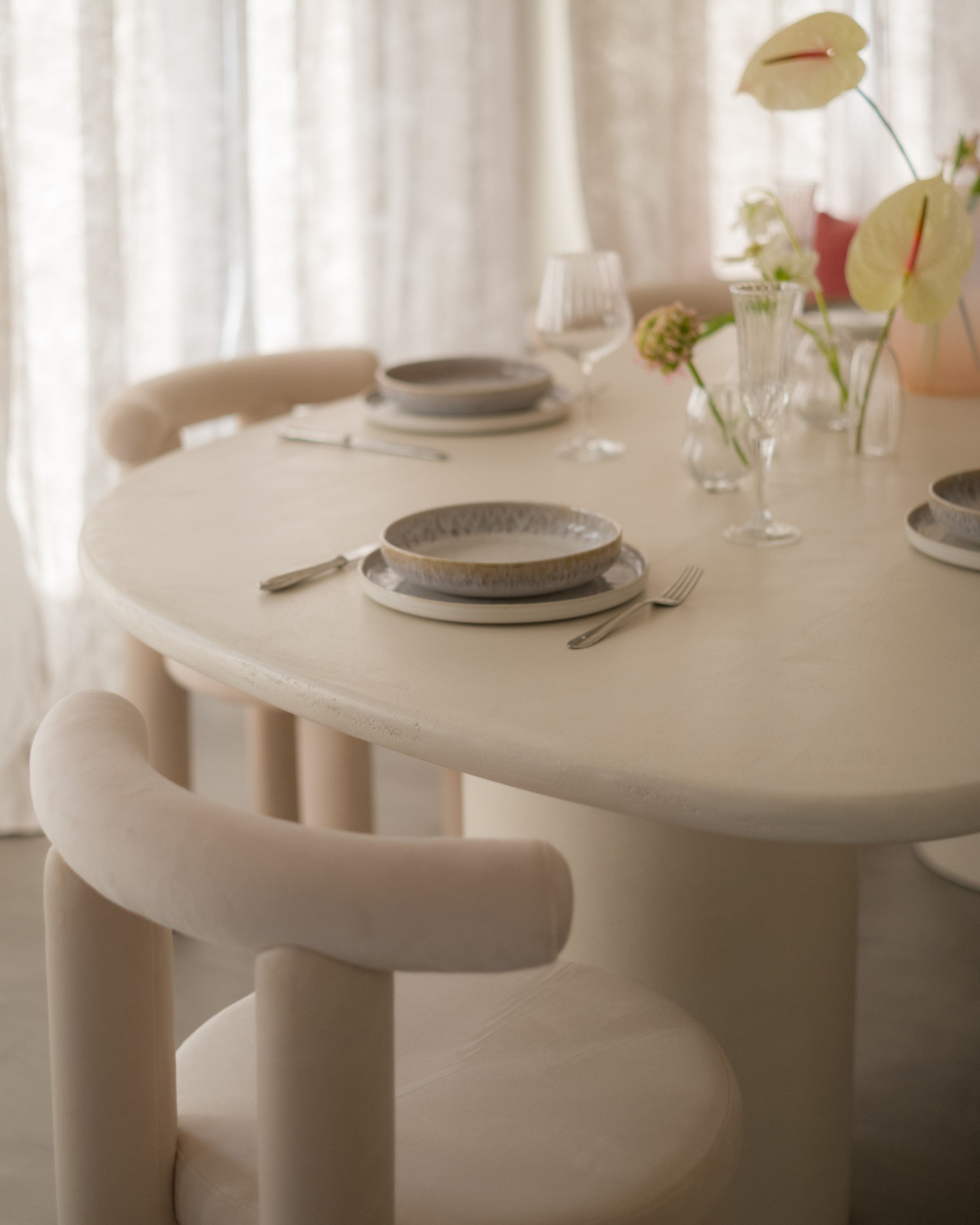 Detail of Kanso Wing microcement dining table surface and organic curve