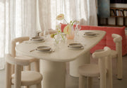 Kanso Wing microcement dining table styled with pendant light in dining room