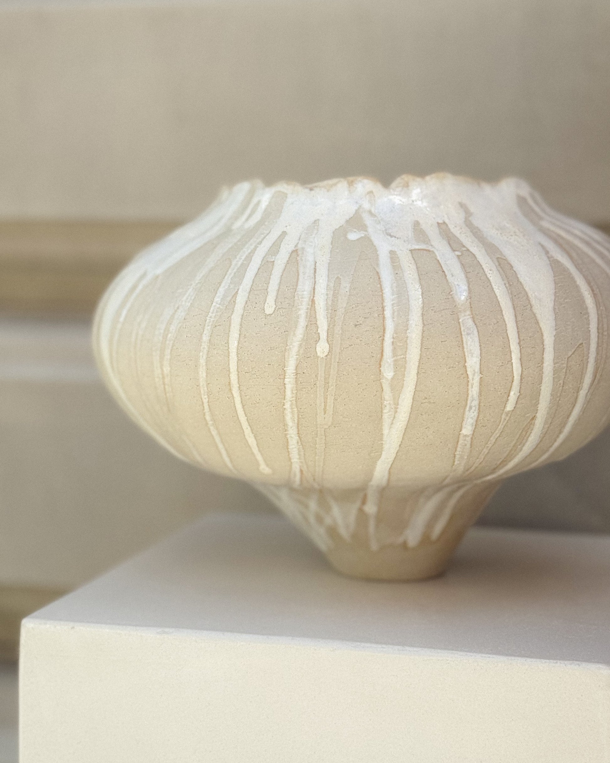 Detail of Muoi Atelier x Syneste ceramic vase with textured glaze.