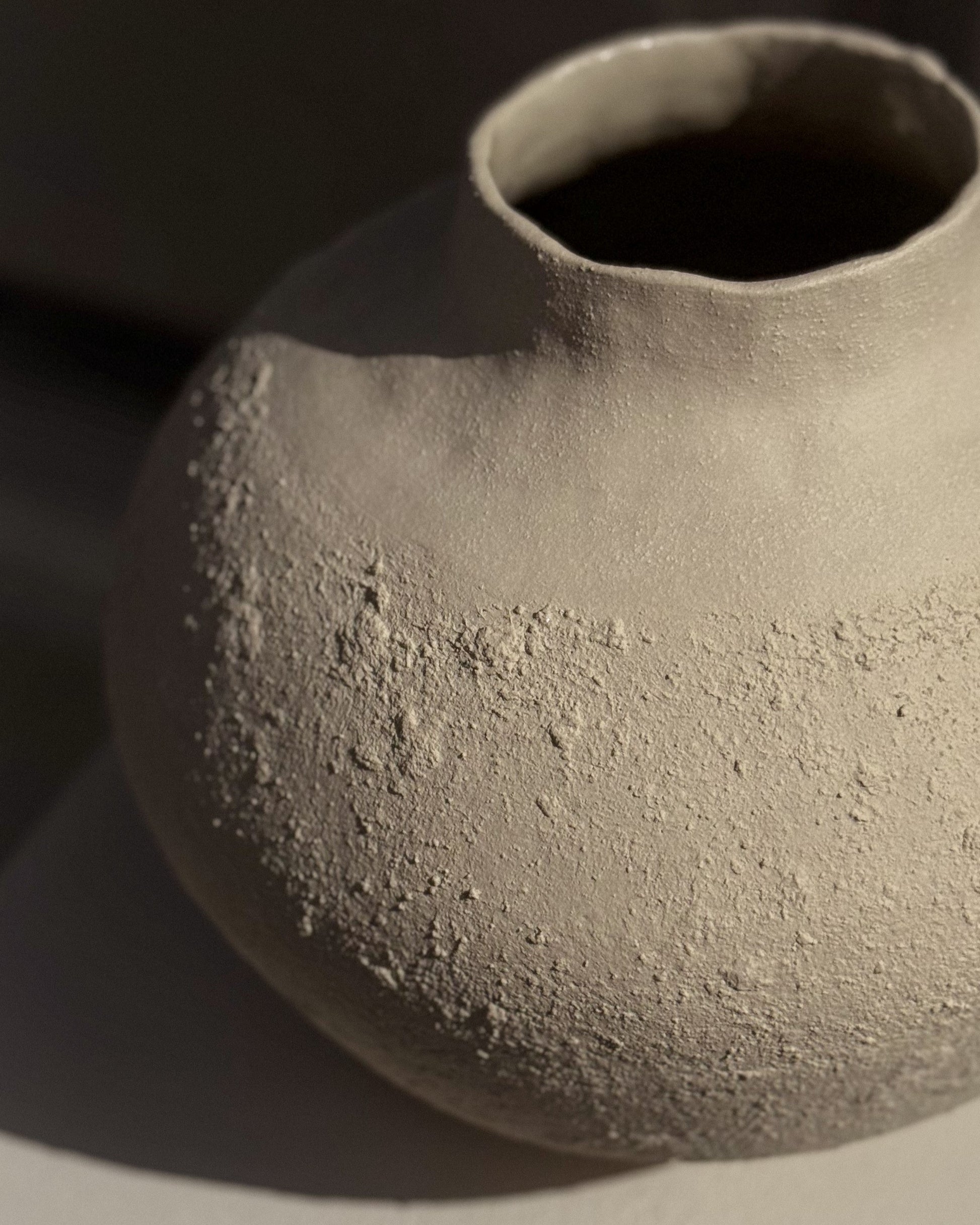 Close-up of stoneware surface, showing handcrafted detail and subtle natural texture
